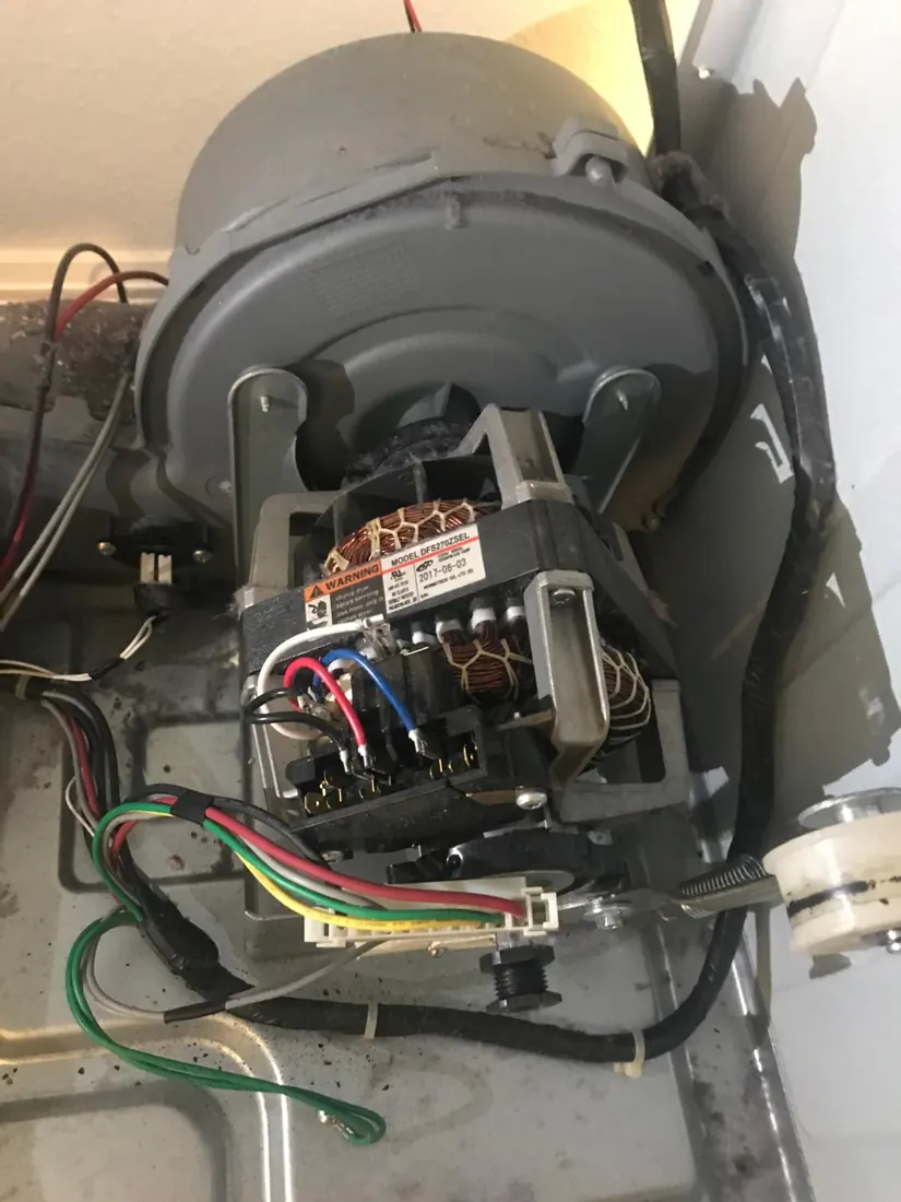 Dryer motor assembly being inspected
