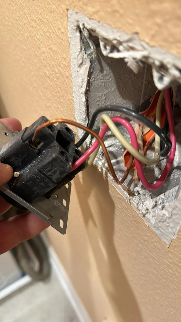 Electrical connection inspected during a service visit